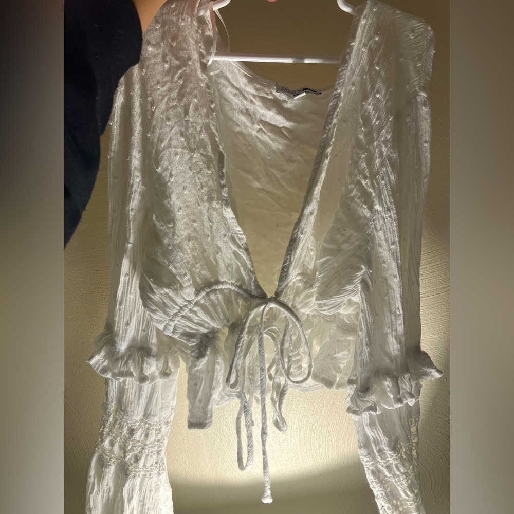 Fashion nova blouse it is wrinkled in picture I can always iron before shipping.